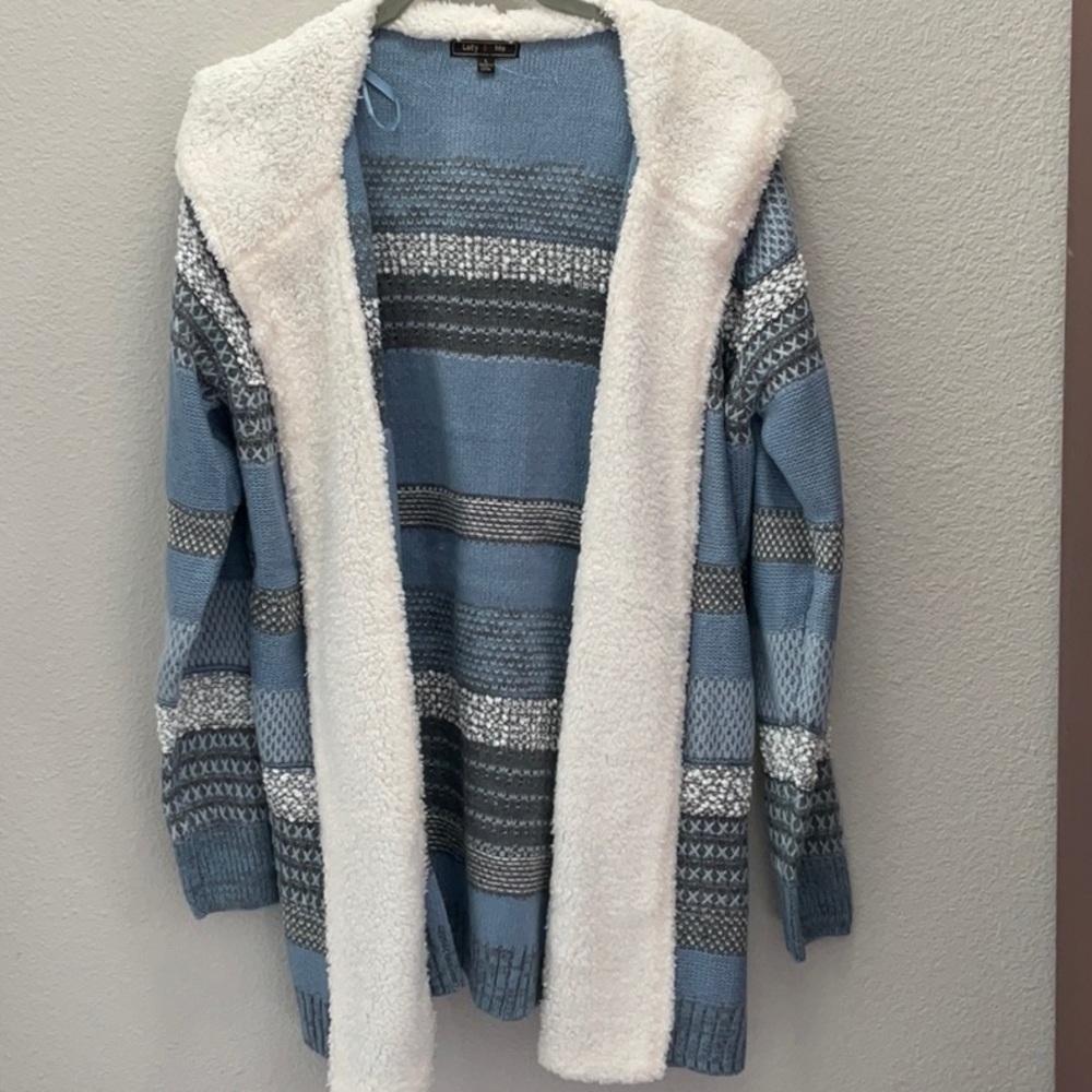 From Lety & Me comes this cozy mid-weight jacket size large done in blues.